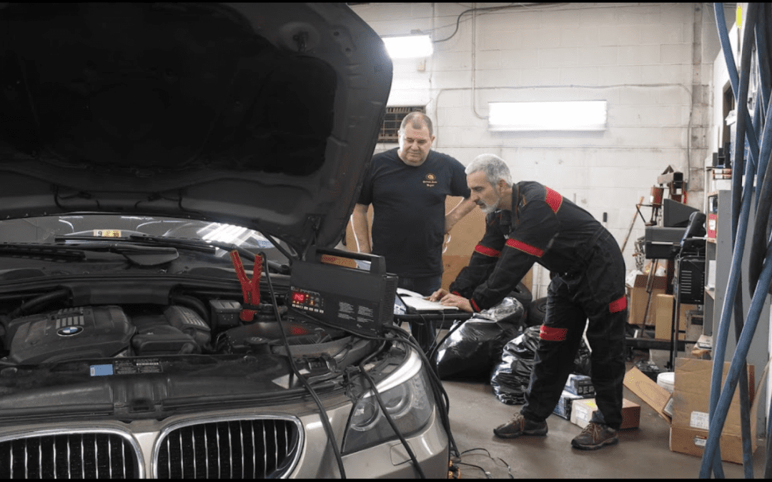Two persons are inspecting car